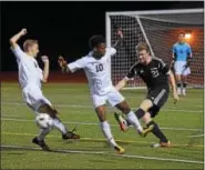  ??  ?? Boyertown’s Ben Vermeesch clears the ball as Pottsgrove’s Germann Larmond (10) and Nate Yuchimiuk (9) try to get in a block Thursday.