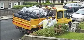  ??  ?? A truckload of rubbish from the property