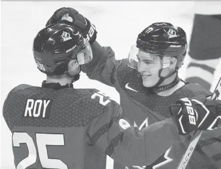  ?? GRAHAM HUGHES/THE CANADIAN PRESS ?? Tyson Jost, right, and Team Canada hope to be all smiles by the end of Saturday’s game against the U.S.