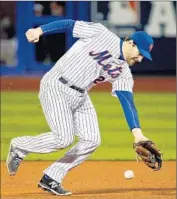  ?? Sean M. Haffey Getty Images ?? NEW YORK second baseman Daniel Murphy is charged with a crucial error in the eighth inning.