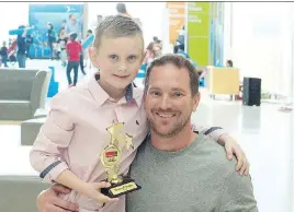  ?? DEANNA MONTALVO ?? Award winner Maxwell Pozzo, with his dad Mike, was given a 911 Heroes Award for helping his father get emergency care after suffering a stroke.