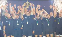  ?? PHOTO / BRETT PHIBBS ?? Richie McCaw holds aloft the Webb Ellis Cup after the All Blacks’ World Cup triumph in 2015.