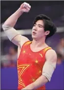  ?? AFP ?? Zhang Boheng reacts after completing his parallel bars routine at the Asian Games.