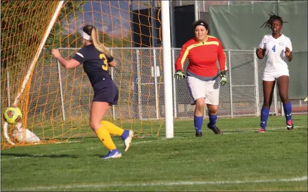  ?? PHOTOS BY JOE LANGSTAFF ?? Mendocino College Eagles freshman McKenzie Turner (3) scores the Eagles’ first goal of the match in the 41st minute vs. Merritt College on Nov. 14. She also scored the Eagles’ second goal in the 87th minute in the Eagles’ 2-1 win.