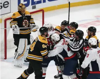  ??  ?? GETTING FEISTY: The Bruins and Capitals scuffle in front of Tuukka Rask during the first period.