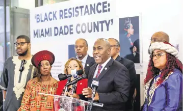  ?? AL DIAZ adiaz@miamiheral­d.com ?? On Friday in Miami, Pierre Rutledge, chair of the Miami-Dade County Black Affairs Advisory Board, unveils a letter to Gov. Ron DeSantis. It said the panel was saddened by his objection to an AP African-American studies class.