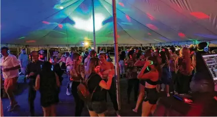  ?? ?? Silent Disco, which started at Therapy Café in 2017, celebrates three years at Yellow Cab Tavern in Dayton on Friday.