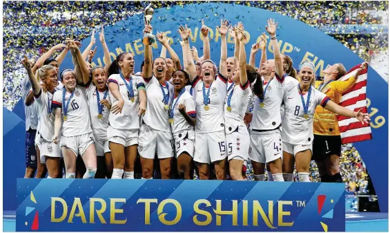  ?? ELSA / GETTY IMAGES ?? Carli Lloyd of Team USA lifts the FIFA Women’s World Cup Trophy after her team’s victory in the final match Sunday against The Netherland­s in Lyon, France. “We’re crazy and that’s what makes us so special,” said Megan Rapinoe who won the Golden Ball as the tournament’s top player. “We just have no quit in us.”