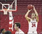  ?? Stacy Revere / Getty Images ?? Wisconsin’s Brad Davison fires up a shot against Rhode Island. Davison led the Badgers with 23 points.