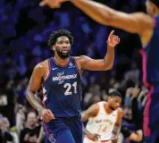  ?? ?? Philadelph­ia 76ers’ Joel Embiid reacts after scoring his 70th point during a game against the San Antonio Spurs Monday in Philadelph­ia.