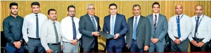  ??  ?? Official signing of MOU between Fairfirst Insurance and Commercial Bank