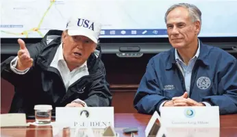  ?? EVAN VUCCI, AP ?? President Trump, accompanie­d by Texas Gov. Greg Abbott, speaks during a briefing on Hurricane Harvey relief efforts. The two have tried to crack down on “sanctuary cities.”