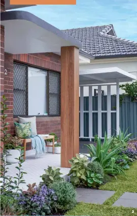  ??  ?? 2 clever cover-up Hide the old wrought iron post supporting the portico and add a different material to the mix by boxing it in with timber decking boards.