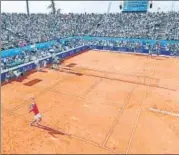  ?? AFP ?? ■
Novak Djokovic serves against Viktor Troicki during an exhibition match hosted by Djokovic in Belgrade on Saturday.