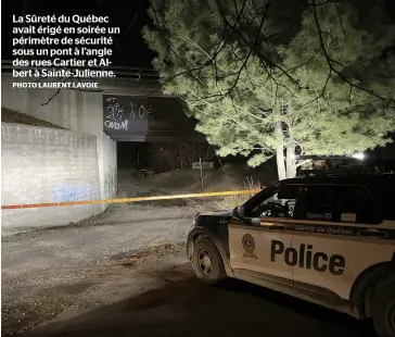  ?? PHOTO LAURENT LAVOIE ?? La Sûreté du Québec avait érigé en soirée un périmètre de sécurité sous un pont à l’angle des rues Cartier et Albert à Sainte-Julienne.