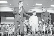  ?? Jacquelyn Martin / Associated Press ?? Republican presidenti­al candidate Sen. Marco Rubio, R-Fla., held a town hall meeting in Myrtle Beach, S.C. and was joined by his sons Anthony, 10, center, and Dominick, 8.