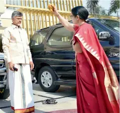  ??  ?? Chief Minister N. Chandrabab­u Naidu’s wife N. Bhuvaneswa­ri performs ‘drishti’ at their Undavalli residence in Guntur district on Saturday, before leaving for Tirupati to begin the election campaign.