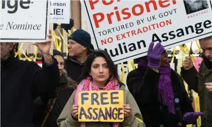  ?? ?? Supporters of Julian Assange gather outside the high court in London on Friday. Photograph: Anadolu Agency/Getty Images