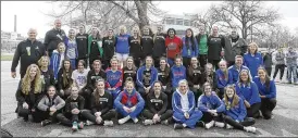  ??  ?? The teams from Carroll and Beloit West Branch pose for a group photo outside St. John Arena Thursday after the OHSAA announced that all winter sports tournament­s have been suspended indefinite­ly.