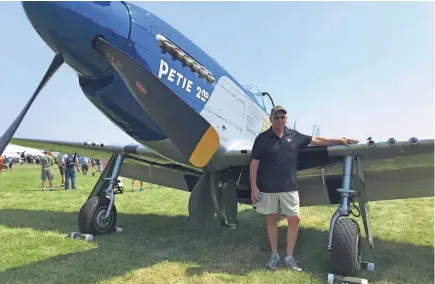  ?? MEG JONES / MILWAUKEE JOURNAL SENTINEL ?? Tony Buechler of Waukesha stands next to the P-51 Mustang he has owned for 34 years. Buechler is flying his Mustang during EAA AirVenture in Oshkosh.