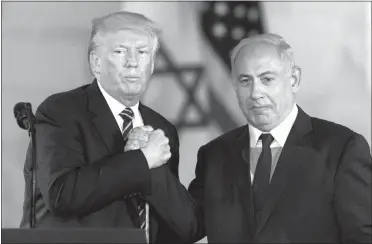  ?? SEBASTIAN SCHEINER / AP FILE ?? President Donald Trump shakes hands with Israeli Prime Minister Benjamin Netanyahu at the Israel Museum in Jerusalem.