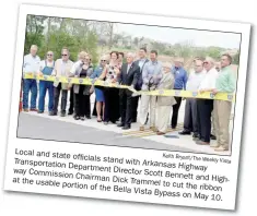  ?? Keith Bryant/The Weekly Vista ?? Local and state officials stand Transporta­tion with Arkansas Highway Department Director Commission Scott Bennett Chairman Dick and Highway at the usable portion Trammel to cut the ribbon of the Bella Vista Bypass on May 10.
