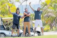  ?? MIKE STOCKER/STAFF PHOTOGRAPH­ER ?? Miami Dolphins players Bobby McCain, Kenyan Drake and Xavien Howard have fun at the third annual Dolphins Cancer Challenge Celebrity Golf Tournament at Turnberry Isle.