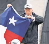  ?? JIMWATSON, AFP/ GETTY IMAGES ?? “We love you,” President Trump tells Texans on his visit to the flooded state.