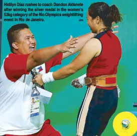  ?? EPA ?? Hidilyn Diaz rushes to coach Dondon Aldanete after winning the silver medal in the women’s 53kg category of the Rio Olympics weightlift­ing event in Rio de Janeiro.