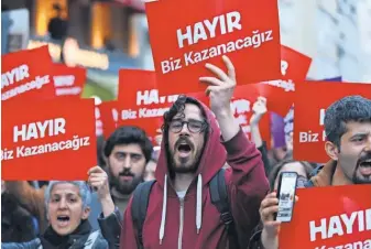  ?? TOLGA BOZOGLU, EUROPEAN PRESSPHOTO AGENCY ?? Protesters shout slogans and hold placards reading “NO we will win” during a rallyMonda­y against Turkey’s referendum results.