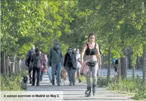  ??  ?? A woman exercises in Madrid on May 2.