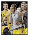  ?? AP/GERRY BROOME ?? Maryland-Baltimore County players celebrate on the bench during No. 16-seeded Retrievers’ victory over top-seeded Virginia in the first round of the NCAA Tournament on Friday night in Charlotte, N.C. It marked the first victory by a 16 seed since the...