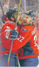  ??  ?? The Capitals’ Alex Ovechkin ( left) celebrates his third- period goal with teammate Kevin Shattenkir­k.
| GETTY IMAGES