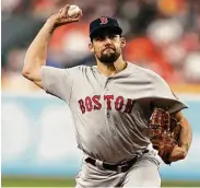  ?? Brett Coomer / Staff photograph­er ?? Boston pitcher Nathan Eovaldi, who is from Alvin, received a four-year, $68 million contract as a reward for his performanc­e in the 2018 postseason.