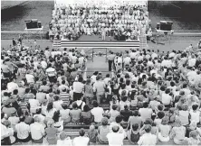  ??  ?? In this July 1977 photo, thousands gather at Del City High School's Eagle Stadium for the annual Starlight Crusade hosted by First Southern Baptist Church of Del City. [THE OKLAHOMAN ARCHIVES]