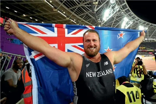  ?? GETTY IMAGES ?? Tom Walsh flies the New Zealand flag in London after his world championsh­ip shot put success.