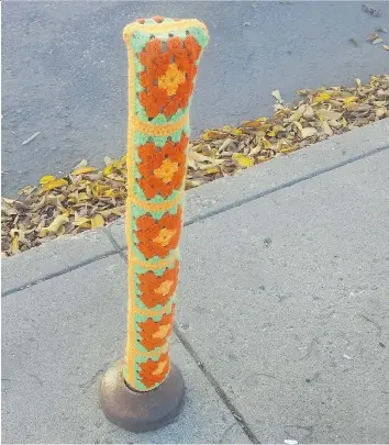  ?? THIA JAMES ?? This is one of the parking meter posts covered by an anonymous “yarnbomber” at 5th Avenue North and 23rd Street. The yarnbomber left a note dedicating the ‘art’ to those suffering from visual impairment.