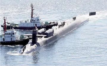  ??  ?? The USS Michigan, a nuclear-powered US Navy submarine, arrives in the port of Busan. — AFP photo