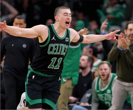  ?? MATT STONE — BOSTON HERALD ?? Celtics guard Payton Pritchard celebrates his 3-pointer during the first half of Boston’s win over the Bucks at the TD Garden.