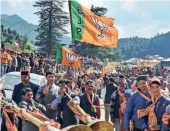  ?? ?? BJP SUPPORTERS in the nomination rally of Chief Minister Jai Ram Thakur, who will contest from Seraj constituen­cy, on October 19.