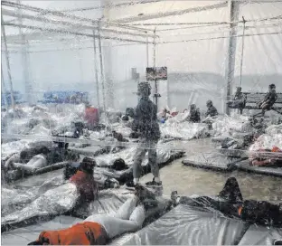  ?? The Associated Press ?? A photo provided by the office of Rep. Henry Cuellar, D-texas, shows detainees in a Customs and Border Protection facility Saturday in Donna, Texas. President Joe Biden’s administra­tion faces criticism for refusing to allow observers in such facilities.