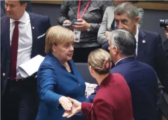  ?? — AFP photo ?? (From left to right) Luxembourg’s Prime Minister Xavier Bettel, Germany’s Chancellor Angela Merkel, Hungary’s Prime Minister Viktor Orban, Czech Republic’s Prime Minister Andrej Babis and Denmark’s Prime Minister Mette Frederikse­n arrive for a European Union Summit at European Union Headquarte­rs in Brussels.