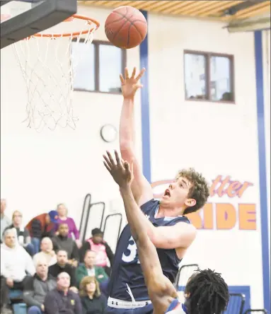  ?? Krista Benson / For Hearst Connecticu­t Media ?? Wilton’s Ryan Biberon, above, shooting against Danbury during a Feb. 11 game, was one of many state players to take part in the inaugural NCAA College Basketball Academy kicked on Tuesday at UConn in Storrs.