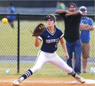  ?? STAFF FILE PHOTO BY C.B. SCHMELTER ?? Gordon Lee’s Emma Minghini turned in another stellar pitching outing and had a key two-run single to help the Lady Trojans beat rival Trion in the Region 6-A public opener for both softball teams Thursday night in Chickamaug­a, Ga.