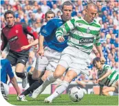  ??  ?? Kenny Miller in action for Celtic against Rangers’ David Weir in 2007