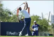  ?? FERNANDO LLANO – THE ASSOCIATED PRESS ?? Erik van Rooyen watches his tee shot on the second hole during the first round of the Mexico Open in Puerto Vallarta, Mexico, on Thursday.