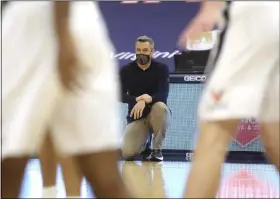  ?? ANDREW SHURTLEFF - THE ASSOCIATED PRESS ?? Virginia head coach Tony Bennett watches a play during an NCAA college basketball game against Miami, Monday in Charlottes­ville, Va.