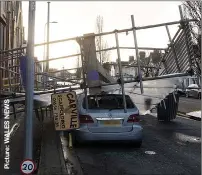  ??  ?? ALL FALL DOWN: Scaffoldin­g hit car in Cardiff