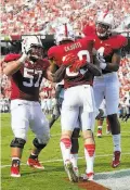  ?? Marcio Jose Sanchez / Associated Press ?? Stanford’s Devon Cajuste (89) celebrates his third-quarter TD reception with teammates.