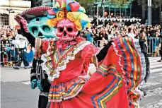  ?? GETTY ?? Mexico City only recently began holding elaborate parades tied to the holiday after a fictional version was depicted in a 2015 James Bond film.
